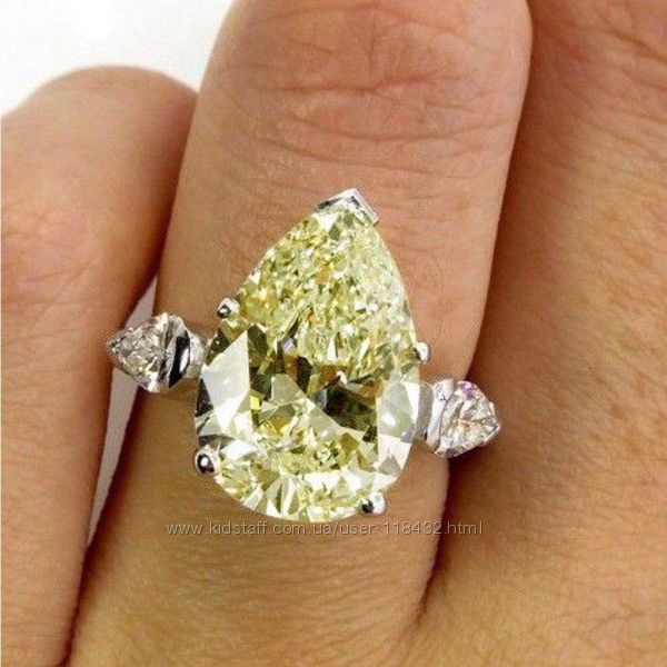 Серебряное кольцо с желтым муассанитом . Размер 16